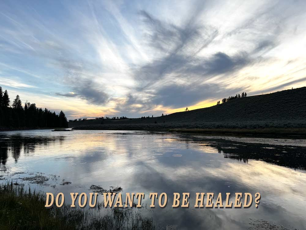 Yellowstone river at sunset with dramatic clouds reflected in still water. Text reads “Do You Want to Be Healed?”